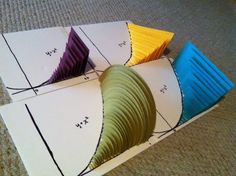 four pieces of paper folded in different colors on top of each other with the same pattern