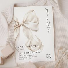 a baby shower is shown with soaps and flowers on the table next to it