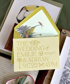 the wedding stationery is displayed on top of cards