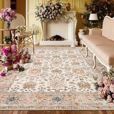 a living room filled with furniture and flowers