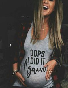 a woman laughing while wearing a shirt that says do's aid it again