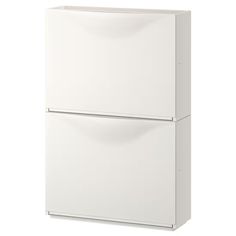 a white refrigerator freezer sitting on top of a white counter next to a wall