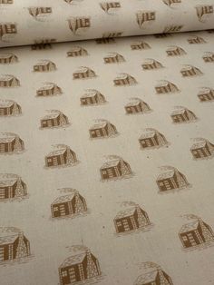 a close up view of a wallpaper with brown houses and buildings on white background