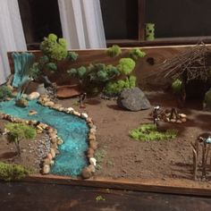 a table that has some rocks and trees on it