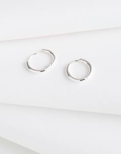 Crafted from 14k gold over sterling silver, our Demi-Fine pieces are future keepsakes meant to be layered and worn every single day (think of them as your jewelry BFFs). These small huggie hoop earrings are perfect for wearing with anything and everything.Please note: If the closure doesn't clasp properly, carefully bend the post back into place. The function can be recovered if the post is slightly bent up a bit.17 mm x 18 mm.100% recycled sterling silver.Do Well: made using recycled factory sc Everyday Sterling Silver Tarnish-resistant Hoop Earrings, Everyday Tarnish-resistant Sterling Silver Hoop Earrings, Small Silver Tarnish-resistant Hoop Earrings, Modern Silver Small Hoop Clip-on Earrings, Minimalist Sterling Silver Clip-on Hoop Earrings, Small Hoop Earrings, Scrap Metal, Every Single Day, Huggie Hoop Earrings