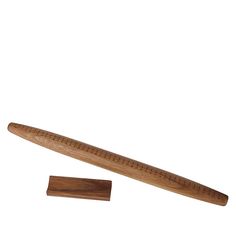 a wooden ruler next to a piece of wood