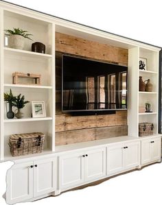 an entertainment center with built - in shelves and a flat screen tv mounted on the wall