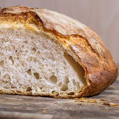 a loaf of bread sitting on top of a wooden table