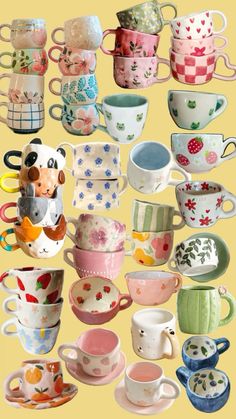 there are many different cups and saucers on this yellow background, one has a teddy bear in the middle