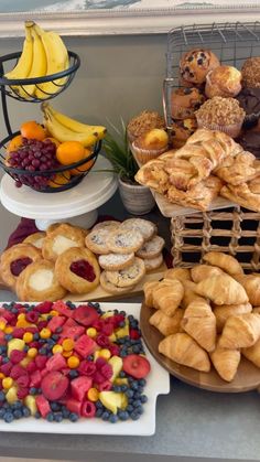 an assortment of pastries and fruit on display