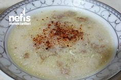 a bowl filled with soup on top of a table