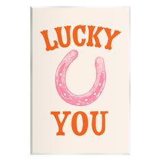 a card with the words lucky you in orange and pink on top of an orange horseshoe