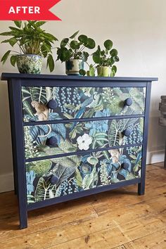 a painted dresser with potted plants on top and another plant in the corner next to it