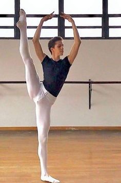 a young man is practicing his ballet moves