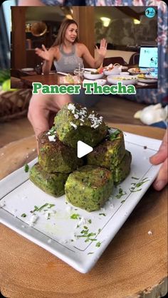 two women sitting at a table with food in front of them and the caption paneer threcha