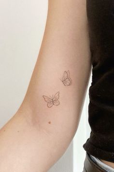 two small butterflies on the arm