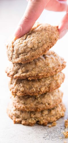 a stack of cookies being held by a hand