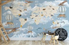 a child's room with a wall mural that has animals and planes on it