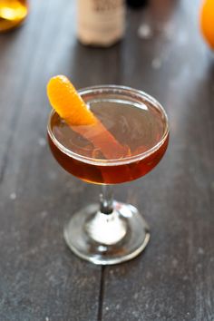 The maple walnut manhattan is a spin on the classic manhattan using black walnut bitters, maple syrup, and a flamed orange peel. The fall-inspired take on the classic cocktail is just as fun to sip as it is to make. Yes, you get to play with some fire and light some expressed orange oil on fire. #manhattancocktail #fallcocktails #holidaycocktails #bourboncocktails Kitchen Swagger, Orange Peels Uses, Classic Tequila Cocktails, Manhattan Cocktail Recipe, Bourbon Maple Syrup, Manhattan Recipe, Brandy Cocktails