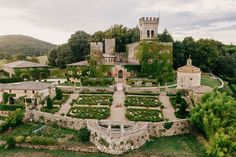 an aerial view of a castle and gardens