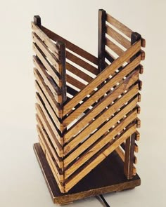 a wooden crate sitting on top of a white table next to a black mouse pad