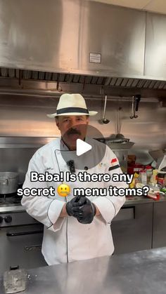 a man in a chef's hat is standing in front of a kitchen counter