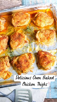 baked chicken thighs in a baking pan with herbs on top and the words delicious oven baked chicken thighs