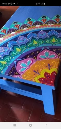 an image of a colorful bed frame made out of wood and painted with acrylic paint