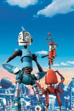 two robots standing next to each other in front of a blue sky and white clouds