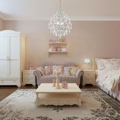 a living room filled with furniture and a chandelier