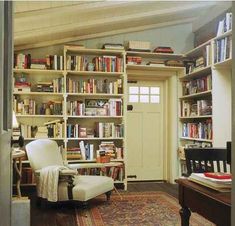 a room filled with lots of books and furniture