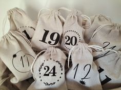 several bags with numbers on them sitting in a pile