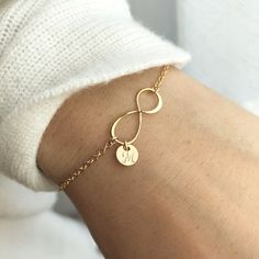 This infinity bracelet makes the perfect gift for a best friend or loved one.Show you mean forever with the infinity symbol, and customize it with their initial on a dainty disk. Item Details: • This listing is for ONE(1) Infinity bracelet.• Made in a 14K shiny gold plate over sterling silver and 925 sterling silver.• Infinity pendant - shiny finish, measures 19mm.• Tiny cute 6mm 22ga disk.• Letter style, Block font or Cursive font (default), upper case or lower case. Waterproof - We make those Diy Infinity Bracelet, Trendy Infinity Jewelry, Personalized Infinity Jewelry For Bridesmaid Gift, Simple Personalized Jewelry For Friendship, Personalized Simple Jewelry For Friendship, Customized Jewelry For Bridesmaid Gift, Trendy Infinity Jewelry Gift, Trendy Infinity Jewelry For Gift, Personalized Infinity Jewelry