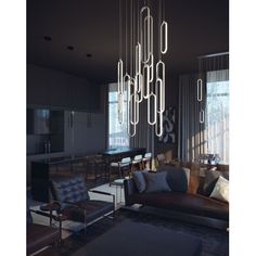 a living room filled with furniture and a chandelier hanging over it's head