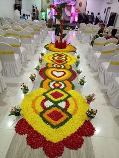 an elaborately decorated aisle in a banquet hall