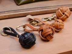 several different types of leather dog leashes on a table