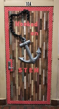 a door decorated with an anchor and red polka dots