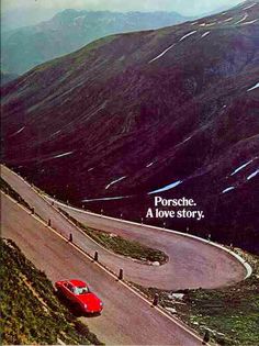 a red car driving down a winding road with mountains in the background and an advertisement for porsche a love story