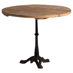 an old wooden table with metal legs and a round top on a white background,