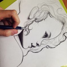 a drawing of a woman's face is shown with a pencil in her hand