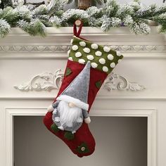 a christmas stocking hanging from a mantel