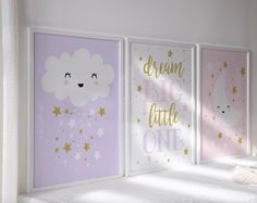 three children's wall art prints in pastel colors with stars, clouds and the words dream big little one