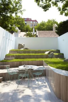 an outdoor dining area with grass on the ground