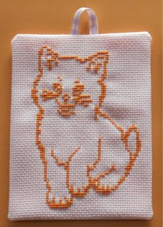 a white bag with an orange cat on it