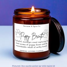 a candle that is sitting in front of a blue background with the words happy breathe on it