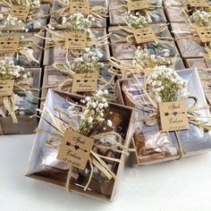 small packages with flowers tied to them are sitting on the table