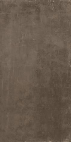 an old, grungy brown wall with some paint on the top and bottom