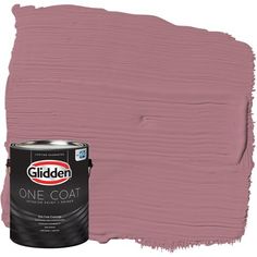 a purple paint can with the word golden on it and one coat in front of it