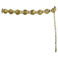 Presenting an incredible gold-tone Gianni Versace chain belt designed by Gianni Versace. From the Spring/Summer 1992 collection, this chic belt debuted on the season's runway in multiple looks and is constructed with gold-tone Versace Medusa logo links. This fabulous Gianni Versace chain belt is an iconic must-have addition to any wardrobe or collection! Approximate Measurements: Length: 34 - 42" Width: 1.25" Medusa Medallion, Versace Chain, Chic Belt, Versace Runway, Daisy Jones And The Six, Fashion Png, Draping Fashion, Versace Gold, Daisy Jones