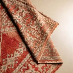 an old rug is laying on top of the other one, which has been folded over